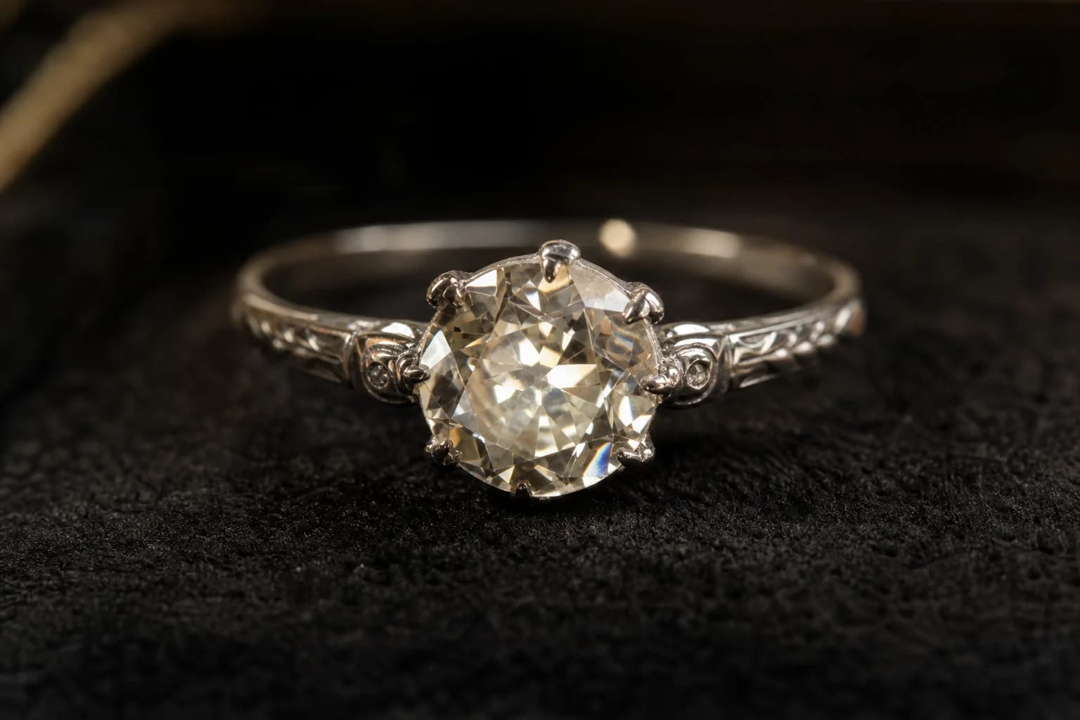 Antique Old European cut diamond solitaire in its original platinum mounting on charcoal velvet